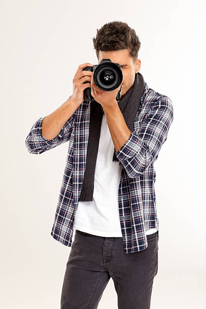 istock Male photographer taking a picture with digital camera 181089054