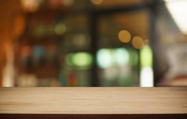 istock Mock up for space. Empty dark wooden table in front of abstract blurred bokeh background of restaurant . can be used for display or montage your product 1810892198