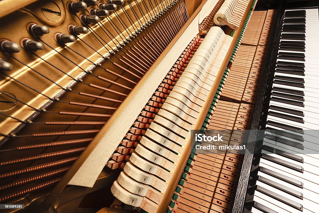 Piano keys and hammers Wide angle closeup view of an upright piano - Piano keys and hammers Black Color Stock Photo