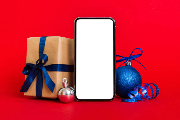 istock Digital phone mock up with rustic Christmas decorations for app presentation with empty space for you design. Christmas online shopping concept. Tablet with copy space on colored background 1810893896