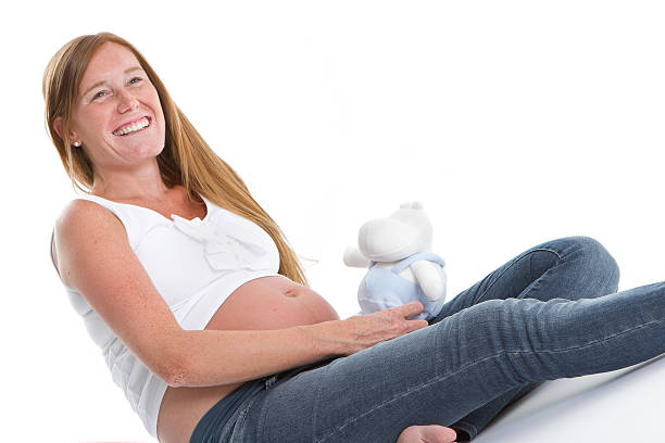 istock The best gift - Pregnant belly with stuffed toy 181089785