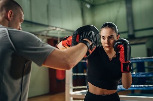 A female fighter practices her punch