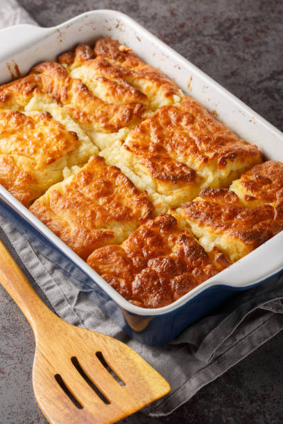 istock Butter Swim Biscuits are buttermilk biscuits that are baked drenched in butter for a biscuit that has a crispy crust with a soft and fluffy inside closeup. Vertical 1810903349