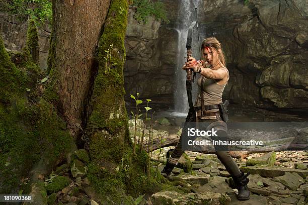 Female Heroine In The Jungle Hunting With Bow And Arrow Stock Photo - Download Image Now