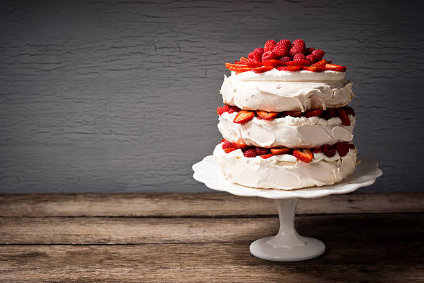 Layered Strawberry and Raspberry Pavlova with Copy Space "Pavlova is a cake-like dessert, popular in New Zealand and Australia, and made up of layers of meringue, whipped cream and fresh fruit." pavlova stock pictures, royalty-free photos & images