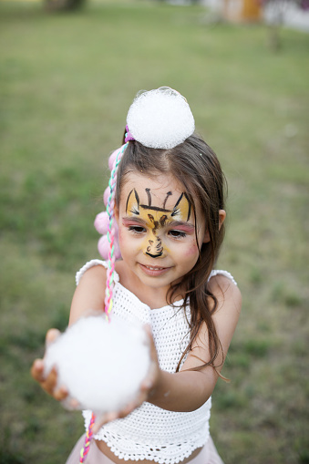 Little Girl at foam birthday party Foam party at home yard with lot of shampoo for fun