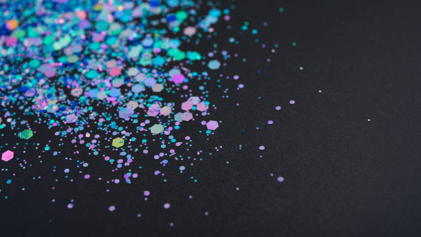 istock Multicolored glitter on black background, close-up 1810914936