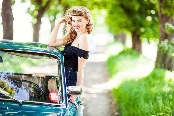 istock Pin-up girl with car 181091975
