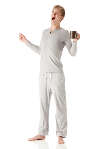 Man holding a cup of coffee and yawninghttp://www.twodozendesign.info/i/1.png