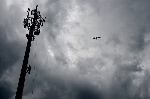 istock Low Angle Shot of Communications Tower Silhouette 181092656