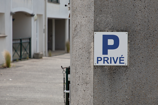 parking p prive french text sign blue means car private parking in the residence entrance wall