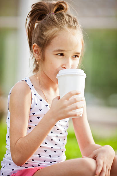 istock Little girl enjoying a milkshake 181092986