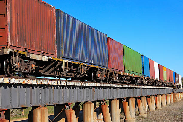istock Trainload of containers crossing low viaduct 181093119