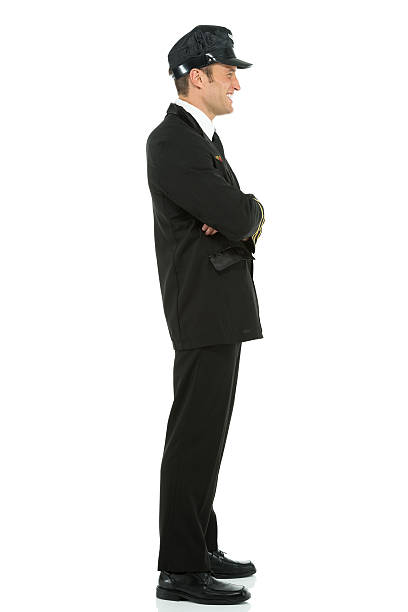 istock Smiling airlines pilot standing with arms crossed 181093641