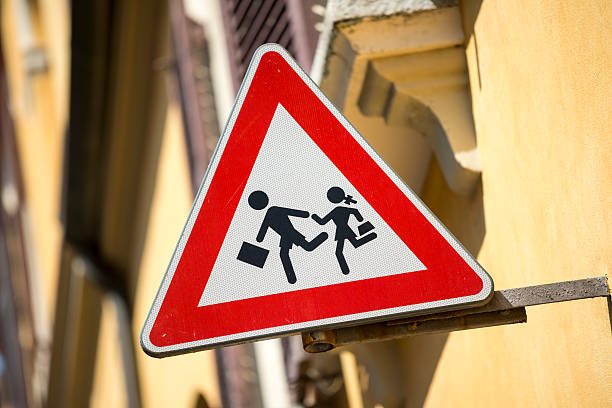 istock Student road crossing warning sign 181093950