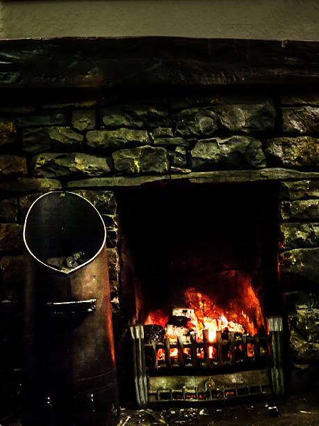 istock Logs and coal burning in stone fireplace 181094742