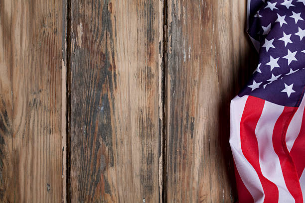 istock American flag on wooden background 181095157