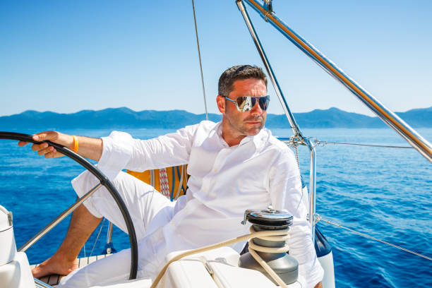 istock Man sailing with sailboat 181095316