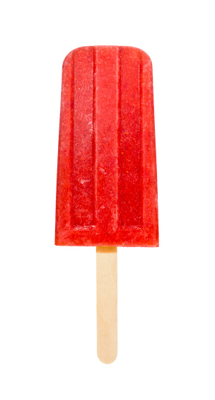 A popsicle made from pureed strawberries frozen onto a wooden stick.