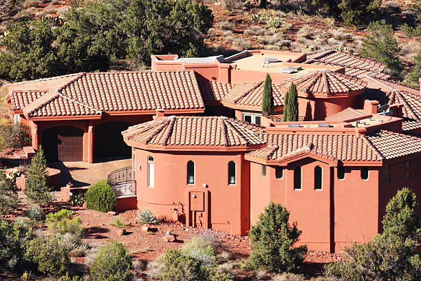 Villa Mansion Home Stucco Facade Architecture Luxury mansion stucco facade and landscaped yard just after sunrise.  Sedona, Arizona, 2013. nook architecture photos stock pictures, royalty-free photos & images