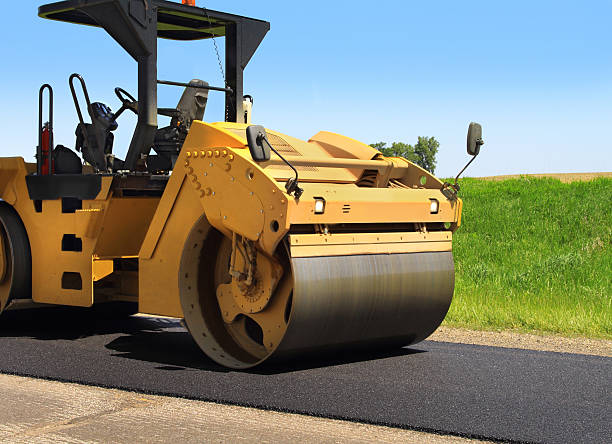 istock Steamroller on newly paved road 181096071