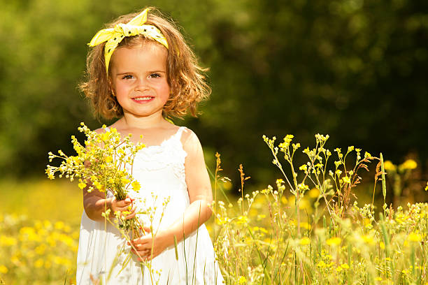 istock Little girl in meadow 181096247