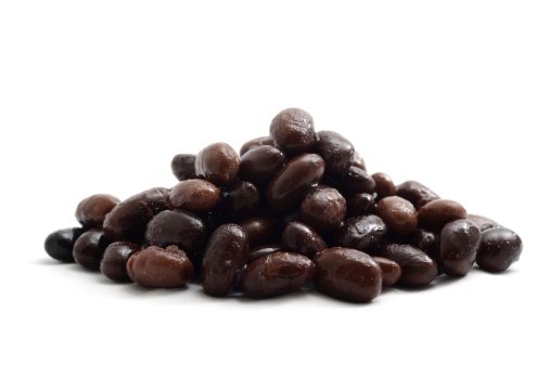 Black turtle beans(cooked) isolated on a white bakground.