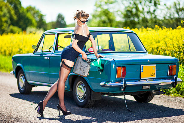 istock Pin-up girl with car 181096276