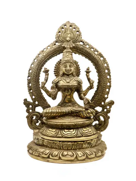 hindu goddess lakshmi with multiple hands blessing in a sitting position, antique brass statue front view isolated in a white background