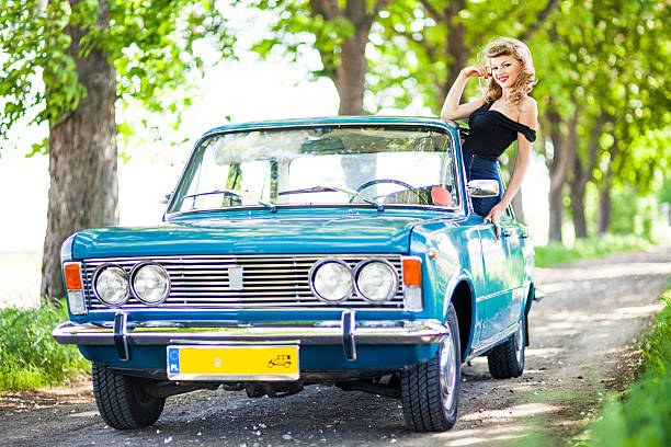 istock Pin-up girl with car 181096453