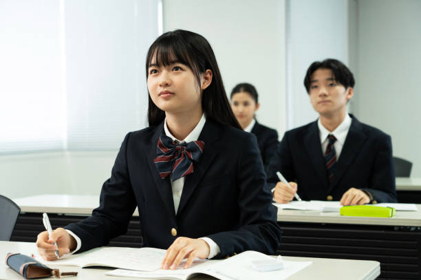 istock Asian teenagers in high school uniforms studying in class 1810972357