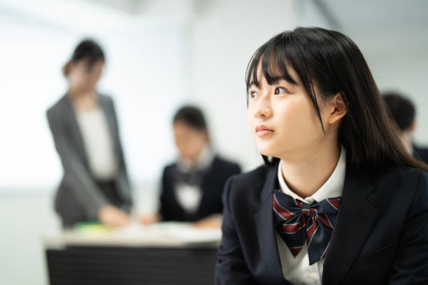 istock Asian teenagers in high school uniforms studying in class 1810972913
