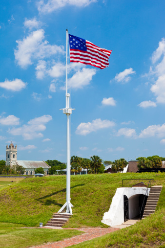 Flag Waving In Fort Moultrie Near Charleston, South Carolina, USA.  The Fort Dates Back To The Late 1700's And Was Operational Until The 1947.  The Flag Flying Is From 1795 And Features 15 Stars And 15 Stripes Unlike The Current American Flag Which Has 50 Stars And 13 Stripes.
