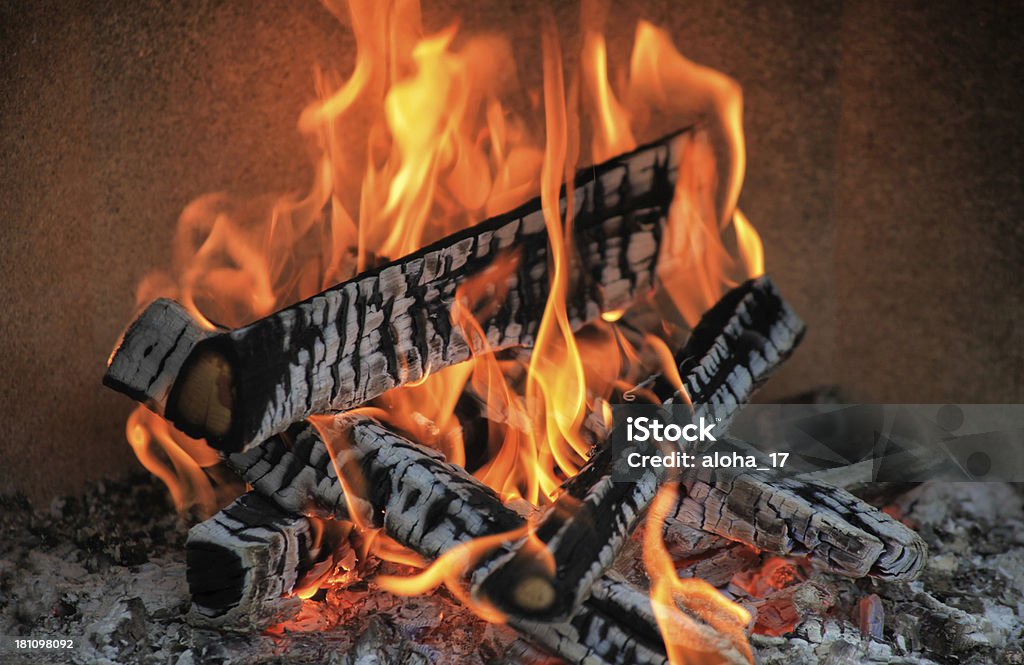 Hot fireplace Burning pieces of oak wood in a fireplace. Abstract Stock Photo
