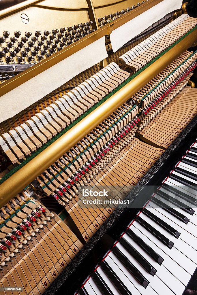 Piano keys and hammers Wide angle closeup view of an upright piano - Piano keys and hammers Black Color Stock Photo