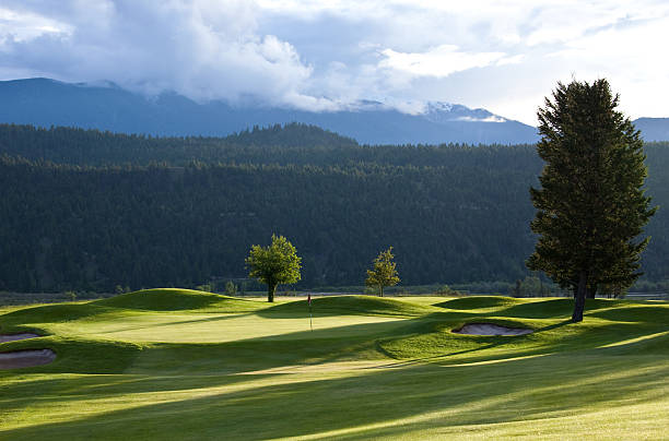 istock view of golf course with mountains in background 181098614