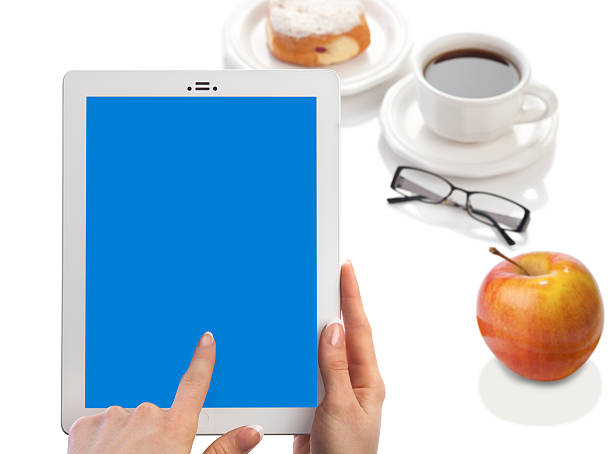 istock Woman Holding Tablet Computer, Blank Blue Screen, With Breakfast 181098943
