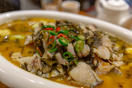 Traditional Suan Cai Yu: Spicy Pickled Mustard Greens with Tender Fish Slices in Savory Broth