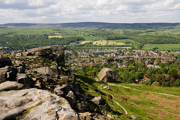 Ilkley town overlooked from Ilkley Moor (Cow and Calf Rocks). Near Leeds, Yorkshire, England