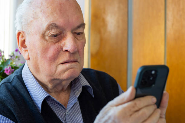 istock Adult senior with hearing aid in his ear 1810993904