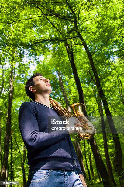 Man With Saxophone Looking Up Stock Photo - Download Image Now - Saxophonist, Adult, Adults Only