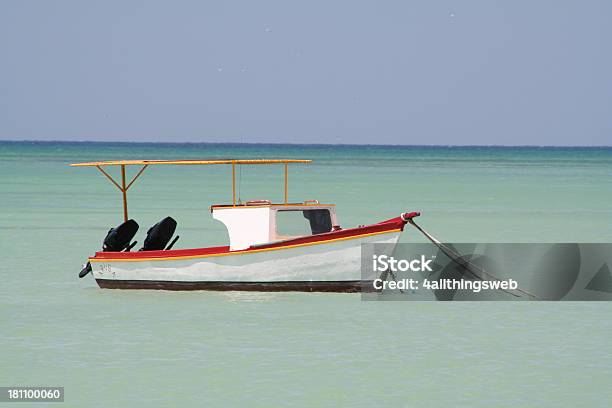 Small Fishing Boat On The Caribbean Sea In Aruba Stock Photo - Download Image Now - Aruba, Caribbean Sea, Coastline