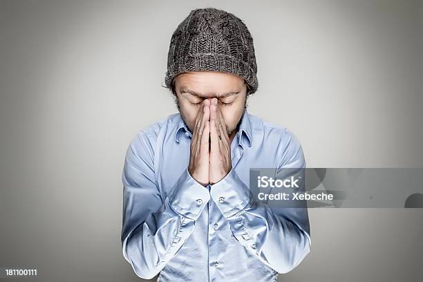 Young Man With His Hands Folded Praying Stock Photo - Download Image Now - Adult, Adults Only, Blue Eyes