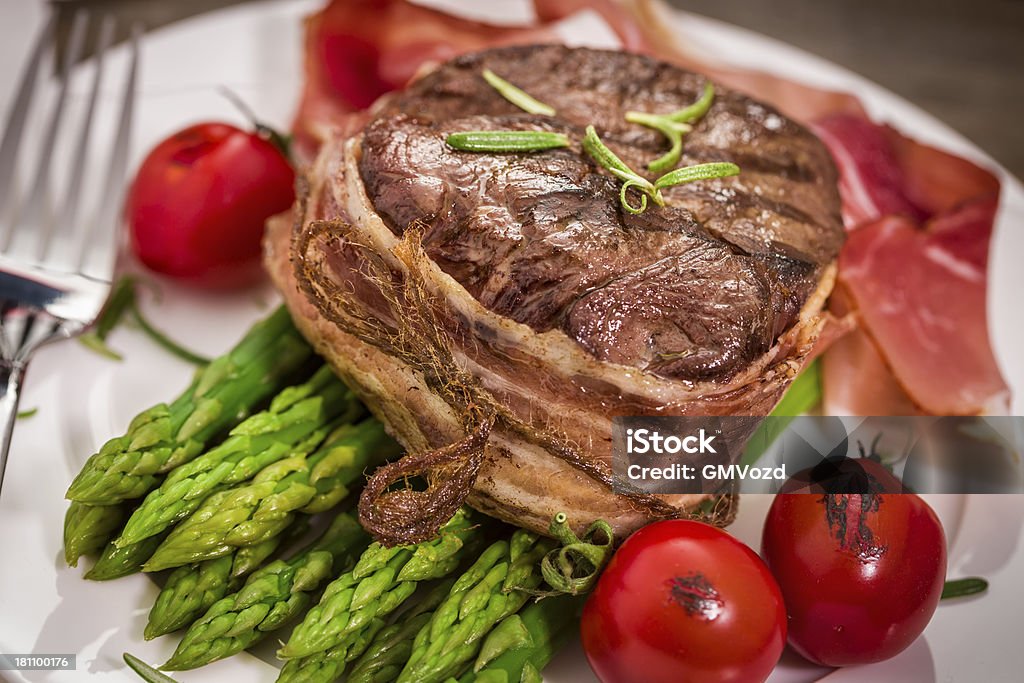 Filet Mignon with Asparagus Grilled filet mignon with bacon and green asparagus Asparagus Stock Photo