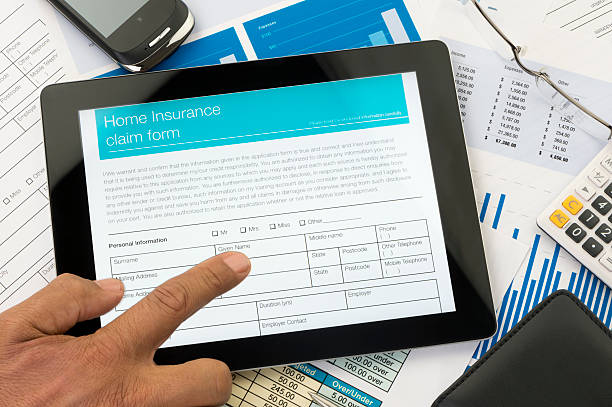 istock Home insurance claim form on a digital tablet 181100257