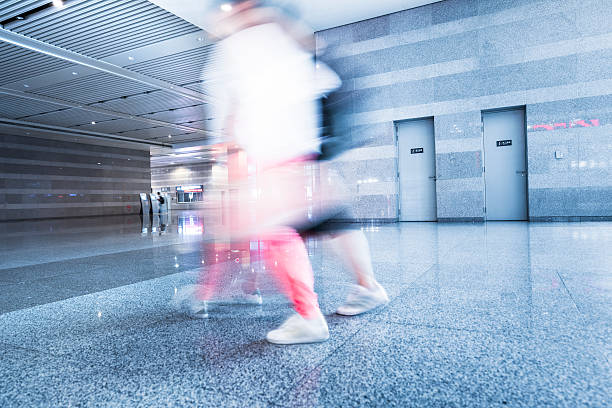 istock motion traveler walking at airport 181100313