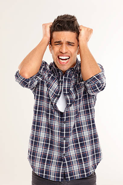 istock Portrait of young man looking frustrated 181100475