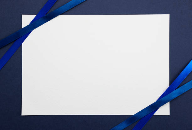 istock close up of  a note card with blue ribbon on blue background 1811009984