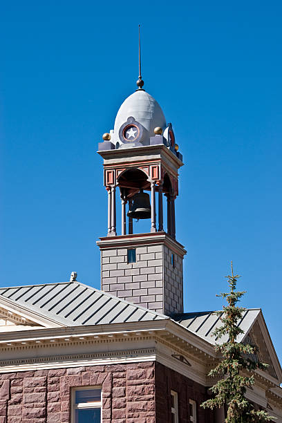 Silverton City Hall Bell Tower Silverton is the county seat and the only incorporated municipality in San Juan County, Colorado, USA. The town is a former silver mining camp, which is now included in a federally designated National Historic Landmark District. Silverton no longer has any active mines and now thrives mainly on tourism. The town is linked to nearby Durango by the Durango and Silverton Narrow Gauge Railroad. At 9,318 feet above sea level, Silverton is one of the highest towns in the country. This picture is of the historic Silverton City Hall and bell tower. jeff goulden government building stock pictures, royalty-free photos & images