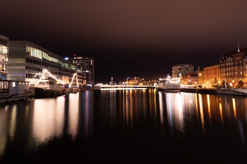 Malmo, Sweden – November 14, 2021: The stunning night skyline of Malmo, Sweden, illuminated by a myriad of golden lights